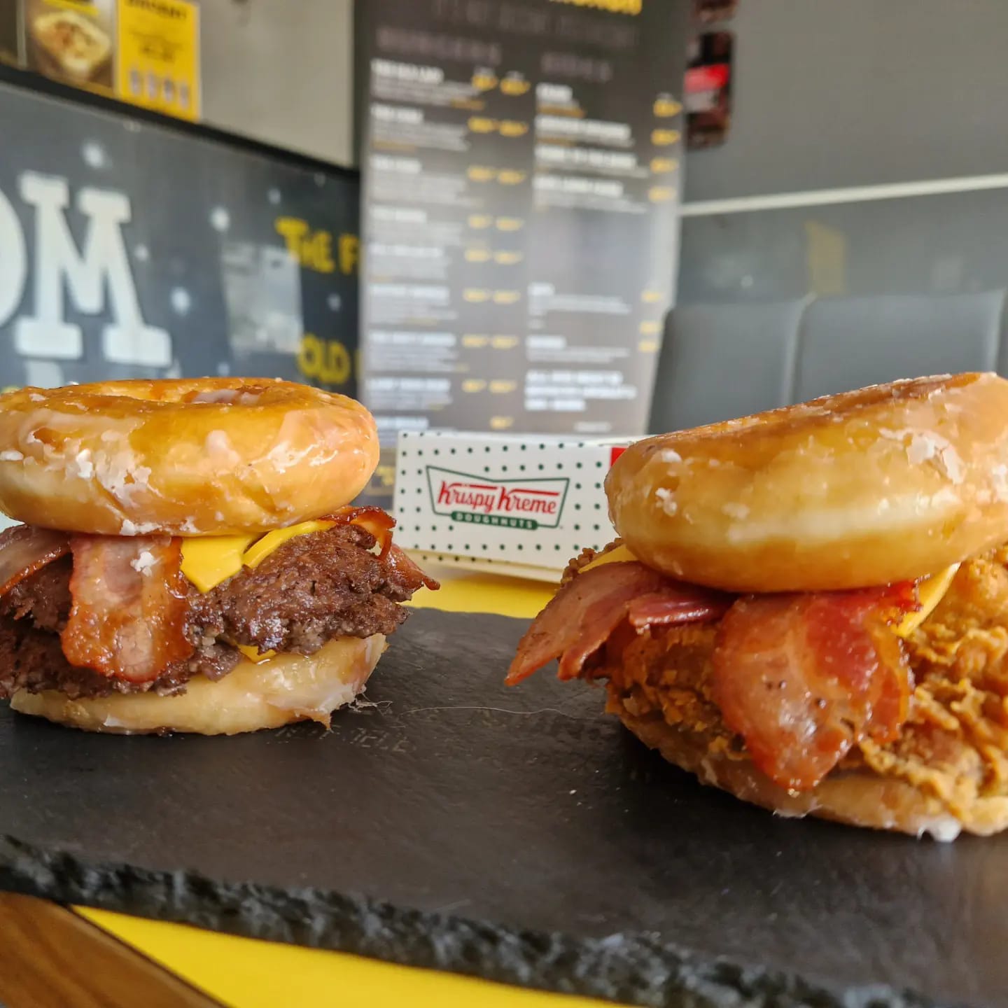 Image of two bacon burgers on a counter in Dacent Munch takeaway, Mayfield, Cork.